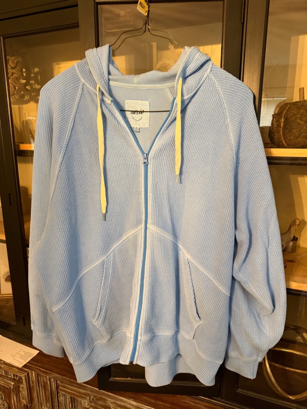 aerie baby blue zip hoodie with white drawstrings